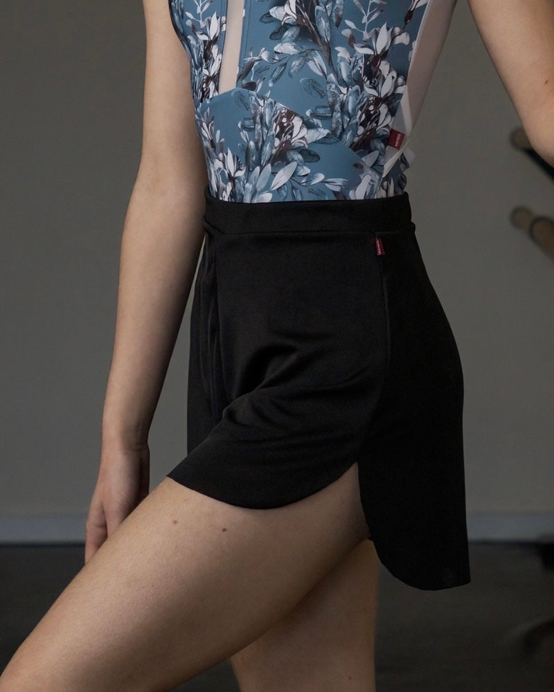 Black slinky dance shorts . Dancer wearing shorts with leotard.