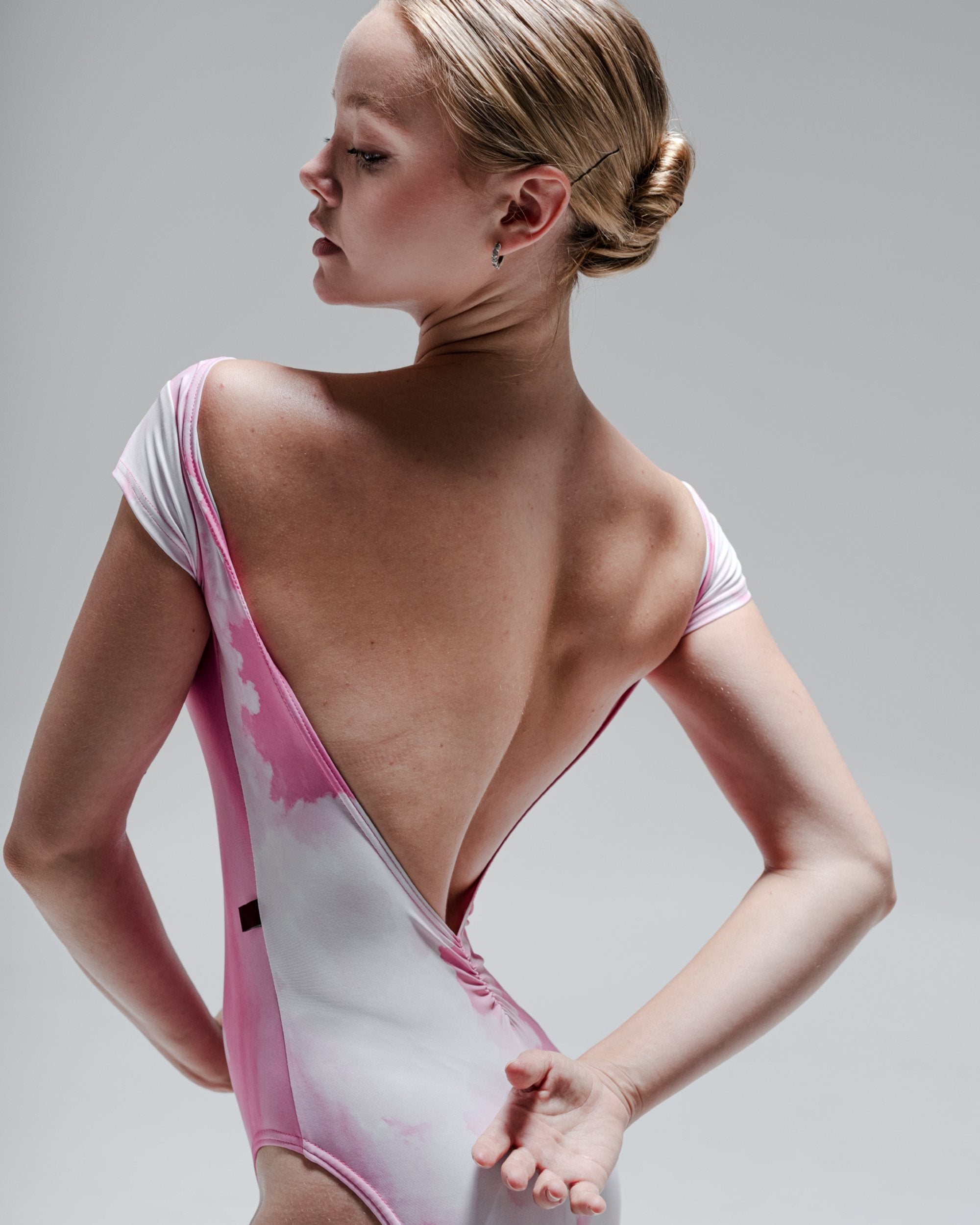 DANCER WEARING LOW BACK PINK LEOTARD