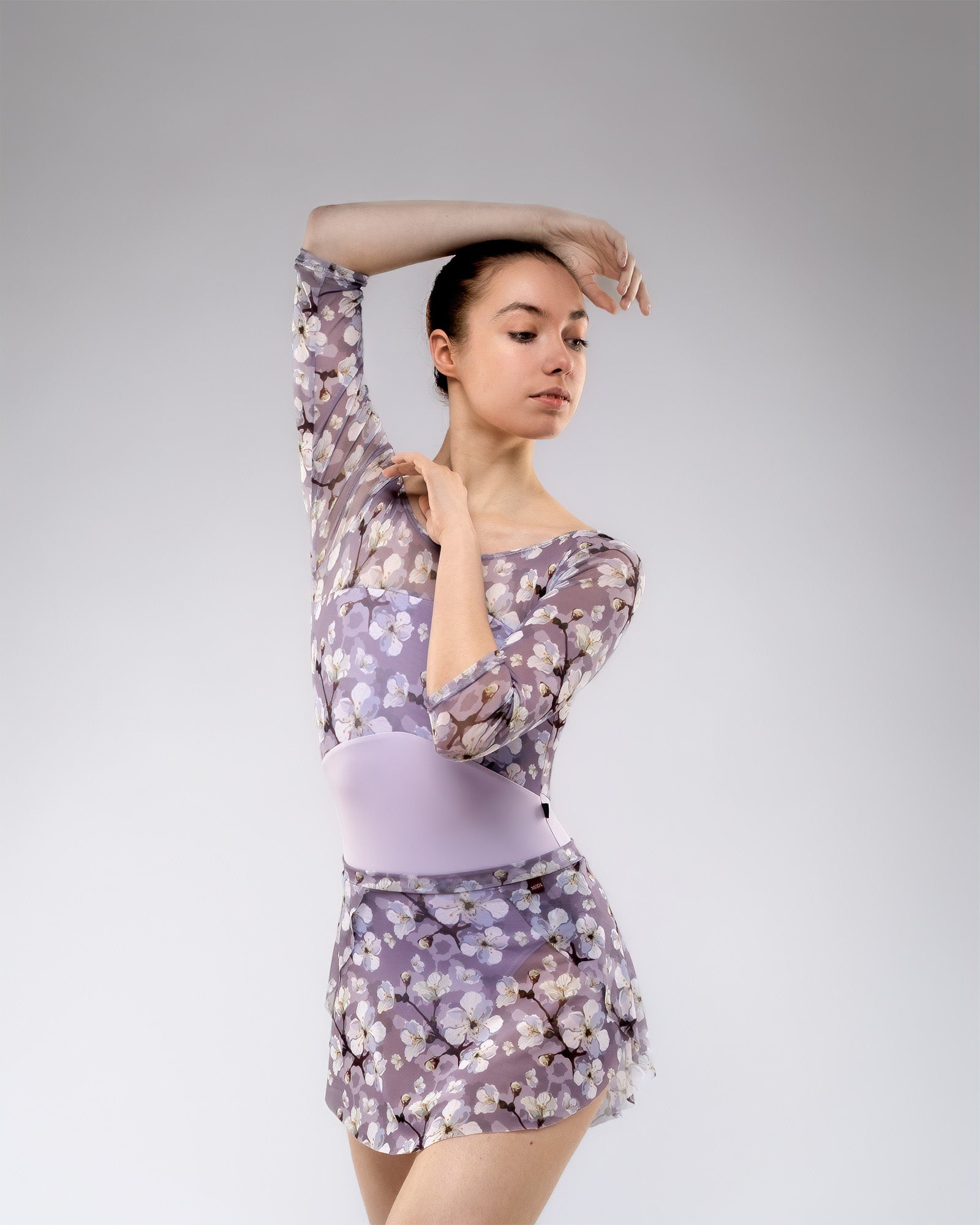 Dancer wearing lilac and purple floral pattern print floaty mesh SAB ballet skirt with matching leotard set