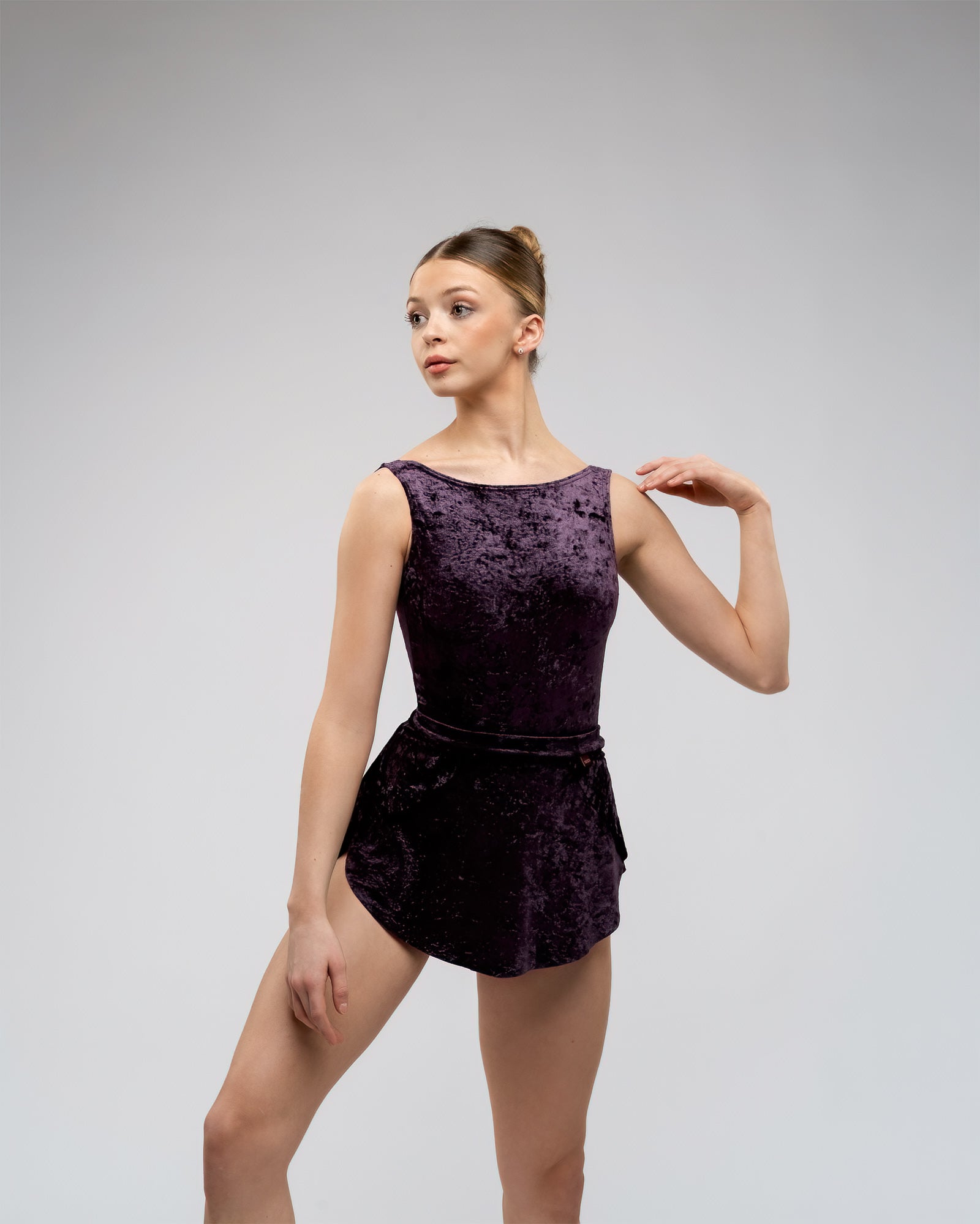 Dancer wearing crushed velvet aubergine purple SAB short velvet ballet skirt